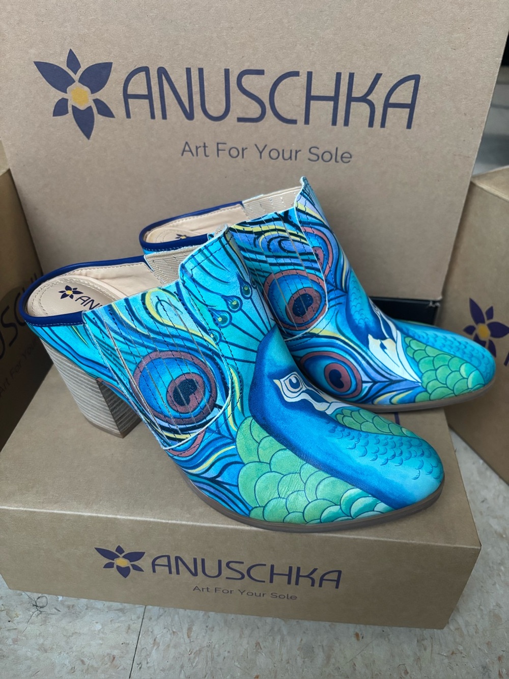 New ANUSCHKA leather Elegant clogs with a vibrant pattern.